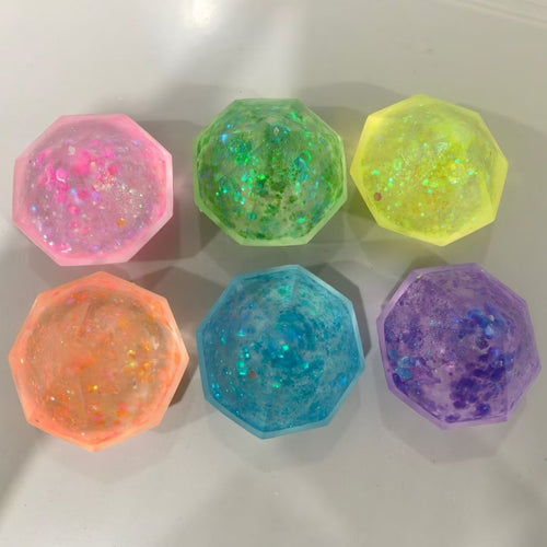 Needoh Groovy Jewel squishy gems in pink, green, yellow, orange, blue, and purple