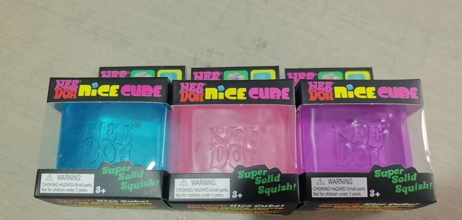 Nee Doh Nice Cube squishy toys in blue, pink and purple with packaging